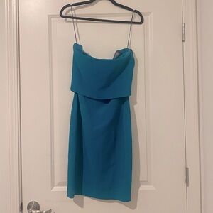 Likely teal formal dress